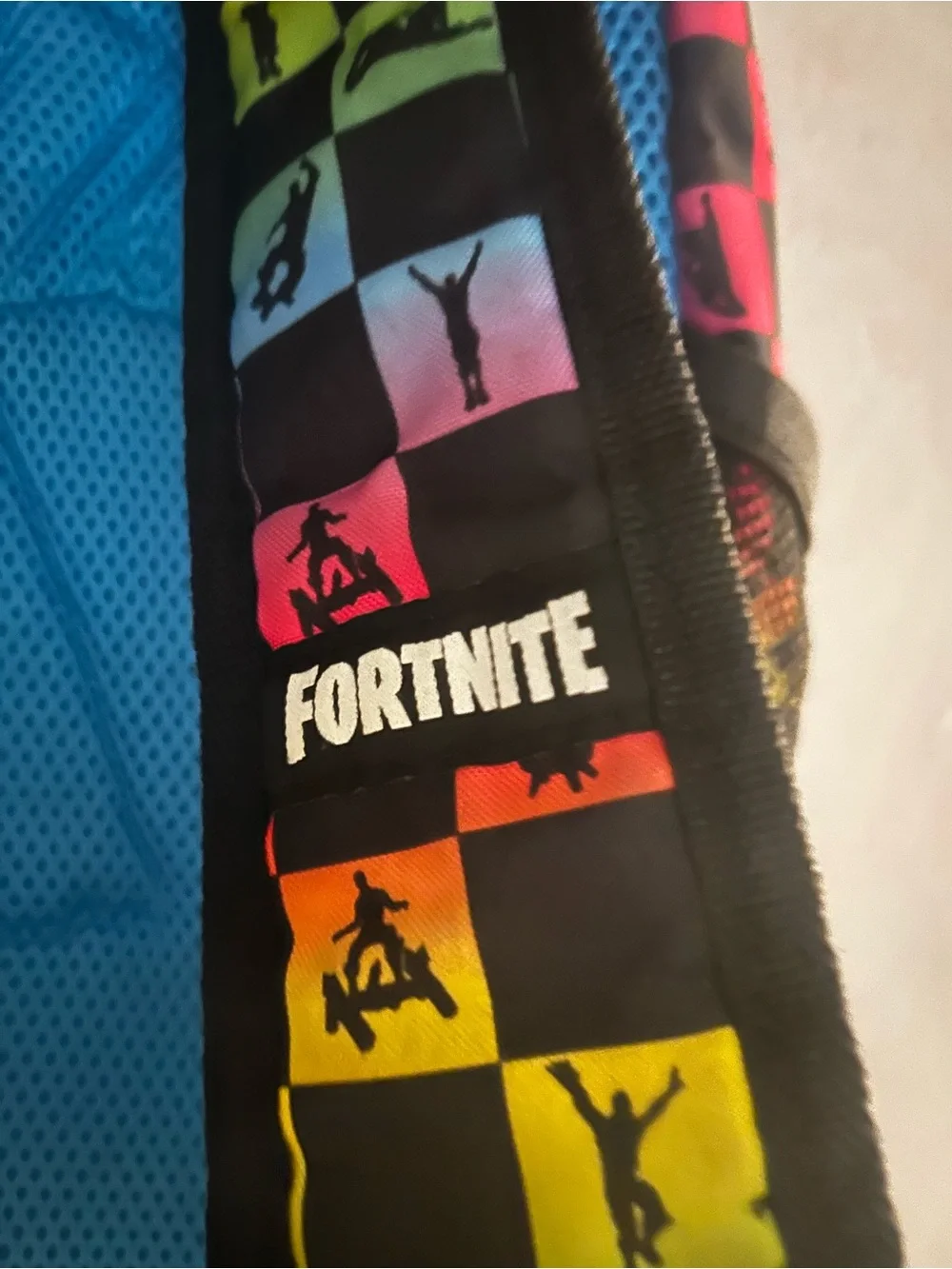 Black Backpack with Rainbow Checkerboard Pattern